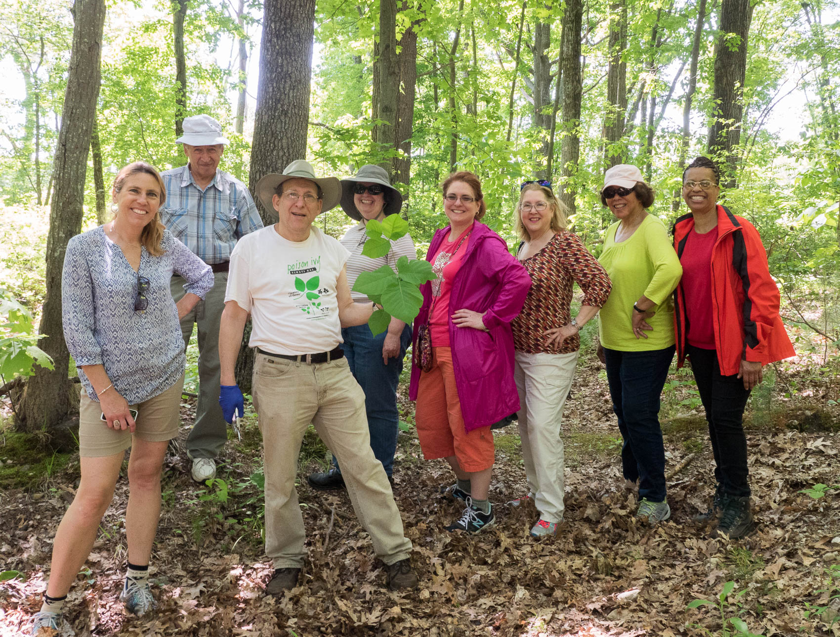 Group  of people with enormous poison ivy leaf